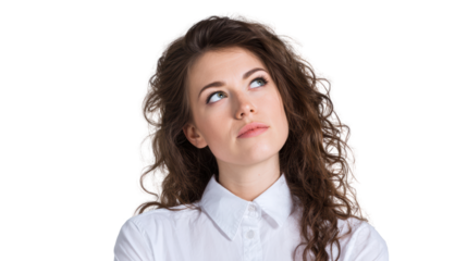 Contemplative woman with curly hair looking up, isolated on a white background.