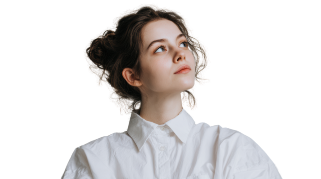 Contemplative young woman in white shirt, looking upwards with thoughtful expression.