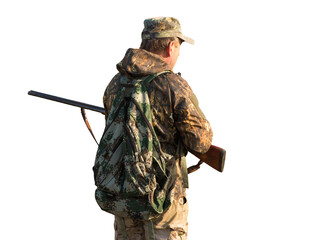 Hunting period, autumn season open. A hunter with a gun in his hands in hunting clothes in the...