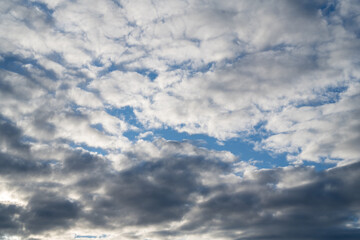 Blue sky with grey clouds, abstract cloudy background