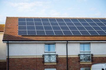 Fototapeta premium solar panels on the roof, sun energy system. Green energy