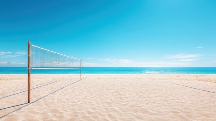Empty beach volleyball net on a sunny sandy beach next to the ocean under a clear blue sky. Concept for summer sport holidays.