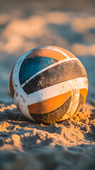 Colorful Volleyball with Orange, Blue, and White Panels on Sandy Beach
