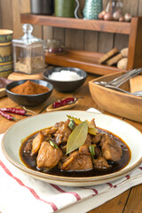 Delicious Filipino Adobo Chicken with Sauce and Bay Leaves