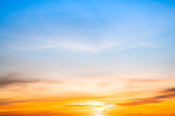 Beautiful , luxury soft gradient orange gold clouds and sunlight on the blue sky perfect for the background, take in evening,Twilight, Large size, high definition landscape photo