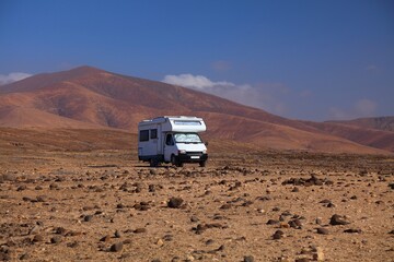 Camper van in Fuerteventura desert landscape