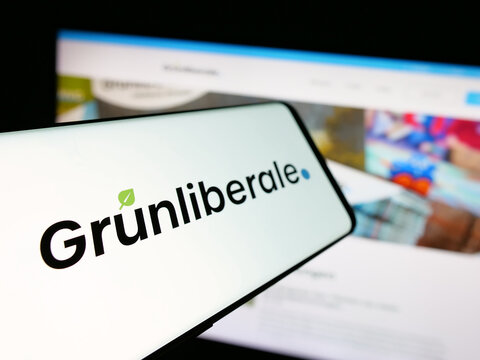 Stuttgart, Germany - 07-30-2025: Smartphone with logo of Swiss party Gruenliberale Partei Schweiz (GLP) on screen in front of website. Focus on center-left of phone display.