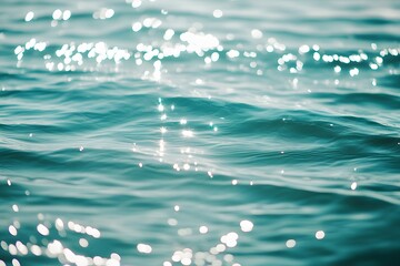 Light sparkles on ocean surface, soft breeze ripples, clean daylight background with natural water texture.