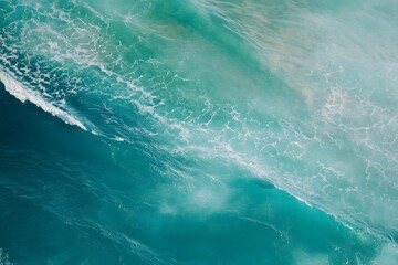 Obraz premium High-angle view of ocean waves forming lines, clear water tone, clean aerial texture