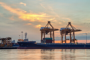 Obraz premium Background for cranes and industrial cargo ships in port during sunrise.