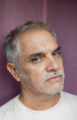 Close-up portrait of older man with salt-and-pepper hair