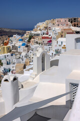Whitewashed buildings on the edge of the caldera cliff in Oia village, Santorini, Greece