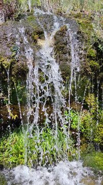 A small waterfall in the mountains of Sairam-Ugam National Park in the Republic of Kazakhstan, Shymkent, Kaskasu gorge. At an altitude of 2000 meters above sea level.