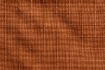 Fototapeta premium Burnt Sienna Ripstop Fabric with Flat Weave Texture in Full-Frame Macro Focus