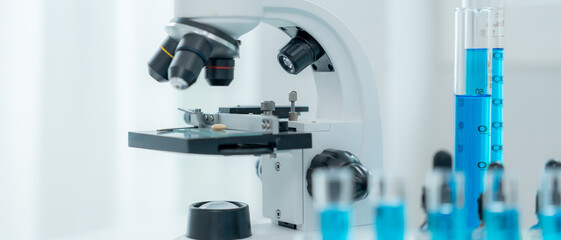 analyze biochemical samples in advanced scientific laboratory. Medical professional use microscope look microbiological developmental of viral. Biotechnology research in science lab.