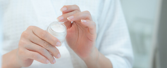 Good skin woman use cream for good skin. face of a healthy woman apply cream and makeup. Advertisement for skin cream, anti-wrinkle, baby face, whitening, moisturizer