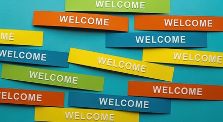 Obraz premium Colorful Welcome Message Blocks Arranged on Blue Background, Emphasizing Hospitality and Invitation for Diverse Applications