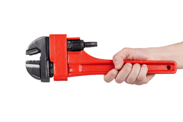 Close up of a hand gripping a red pipe wrench.