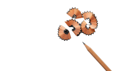 High-key minimalist flat lay of sharp natural wood pencil, wood shavings, graphite dust on white surface with soft light. Concept of creative genesis and innovation