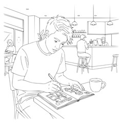 A young man drawing in a sketchbook at a cafe with other people and a barista in the background