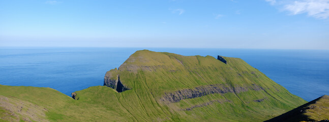 Breathtaking cliffs rise from the North Atlantic Ocean in the Faroe Islands
