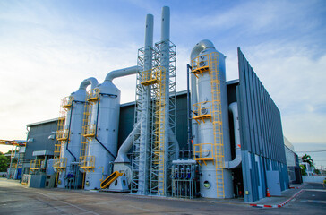 Industrial exhaust air treatment system or wet scrubber system ,Modern industrial plant with a tall...
