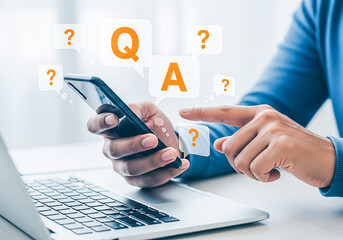 Person using smartphone and laptop with q and a graphics