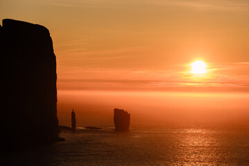 Majestic sunset over Risin og Kellingin in the Faroe Islands creates a stunning silhouette