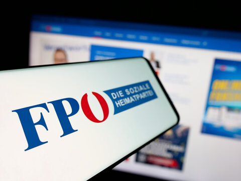 Stuttgart, Germany - 08-01-2025: Smartphone with logo of party Freiheitliche Partei Oesterreichs (FPOe) on screen in front of website. Focus on left of phone display.