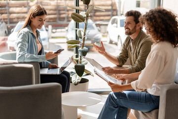 Business team discussing strategy during informal meeting in modern office