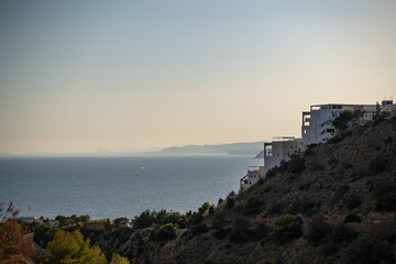Coastal hillside with buildings overlooking Mediterranean Sea