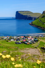 Explore stunning coastal landscapes of the Faroe Islands with charming villages and dramatic cliffs