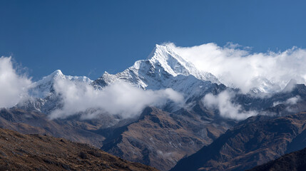 Fototapeta premium Magnificent Snow-Capped Mountains with Sharp Peaks, Pure Snow, and Pale Blue Sky, Conveying Grandeur and Peace