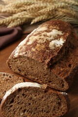 Pieces of fresh rye bread on table, closeup