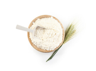 Flour in bowl and green wheat spikes isolated on white, top view