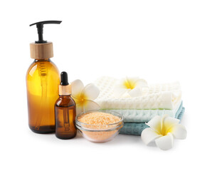 Spa composition with waffle towels and cosmetic products isolated on white