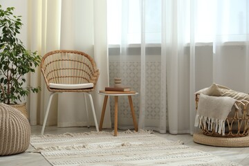 Stylish furniture near window with curtains in living room. Interior design