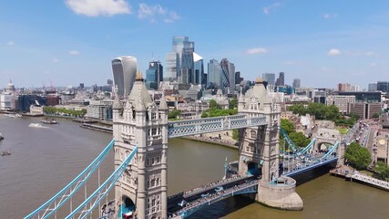 Aerial view of tower bridge over thames river with modern skyline and historic architecture, london, england, united kingdom.
