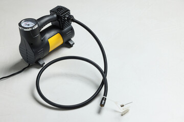 One modern tire inflator on light background