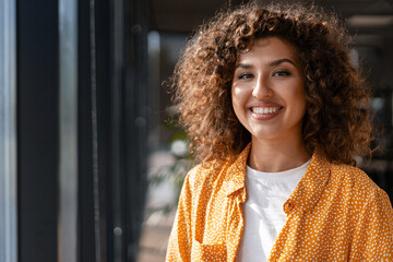 Young businesswoman smiling in modern office building