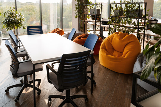 Modern coworking space with beanbag chairs and meeting table