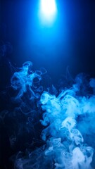 Blue smoke against dark background