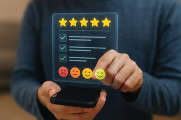 Five star rating with positive feedback and smiling emoticon on transparent screen held by person