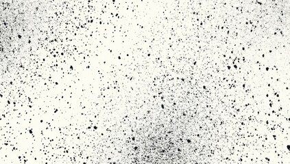 Abstract speckled pattern.  Dark specks scattered on light background