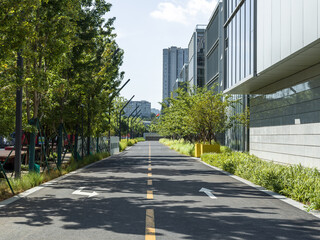 enpty asphalt road with modern office building