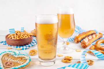 Oktoberfest greeting card background with two beer glasses, salted snack and pretzels. Oktoberfest...