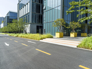 enpty asphalt road with modern office building