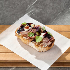Duck bruschetta with berry jam, bright lighting, overhead minimal composition