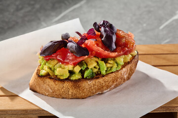 Bruschetta with salmon and avocado, bright natural lighting, overhead composition