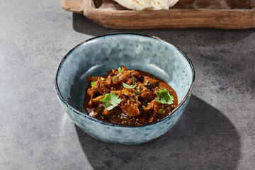Eggplant spread with pita, bright daylight, overhead composition, rustic ceramic bowl